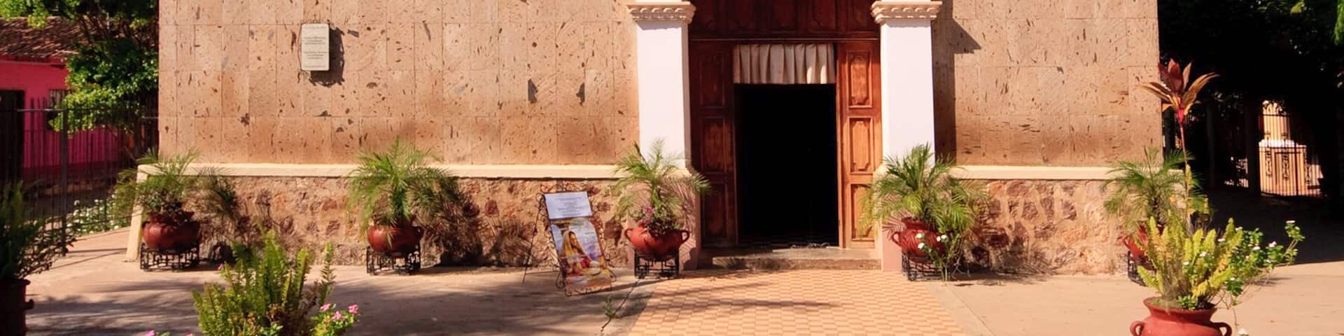 View down tiled path to door of El Quelite Church in Mexico