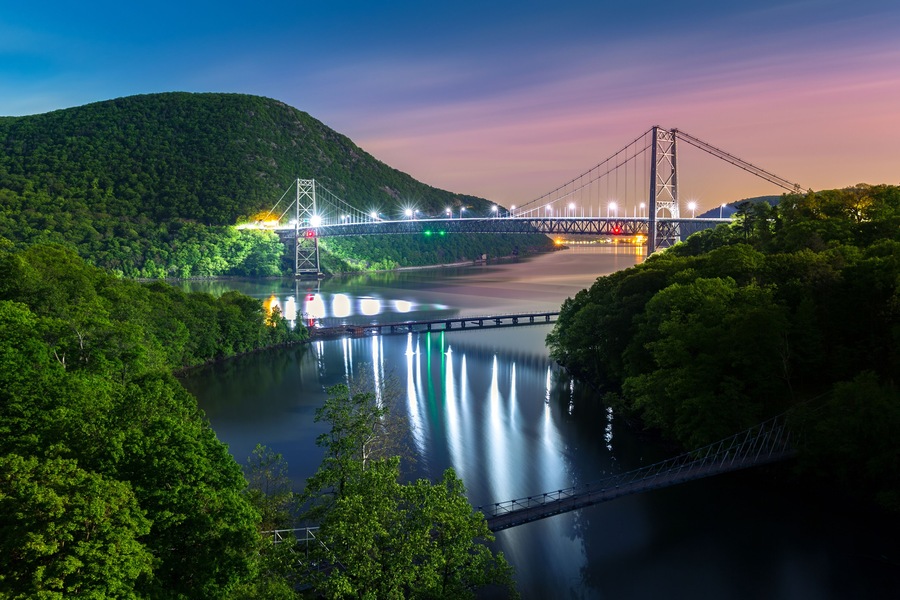 Hudson River valley with Bear Mountain bridge illuminated by night, in New York state