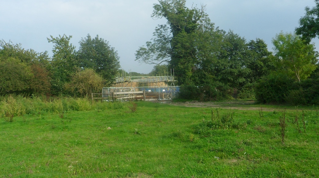 One of a series of photos chronicling the development of Crawley New Town's 14th residential neighbourhood, Forge Wood. This view shows land at the northern end of the Phase 1 development area, shortly before work started in the vicinity. Some building work can be seen directly in front, blocking the public footpath which runs through this field.