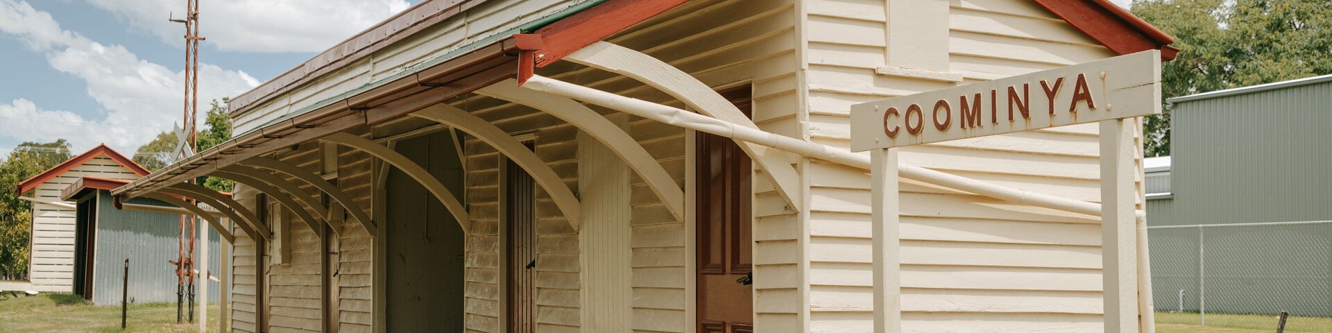 Coominya which includes a small town or village and signage