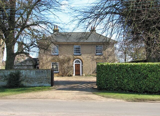 Colts Hall. At the east end of the village green. The village of Shouldham > 1738593 is situated about 10 kilometres north-east of Downham Market (South West Norfolk) and has a population of approximately 500. Immediately to the east and north-east of the village, on the south side of the Nar valley bottom which used to be a fen in medieval times, lies the site of the Priory of the Holy Cross and the Blessed Virgin. This site is a designated National Monument and contains the buried remains of monastic buildings, earthwork enclosures and remains of an extensive water management system including fishponds > https://www.geograph.org.uk/photo/1738428. The site can be accessed via the public footpath turning off Eastgate Street > https://www.geograph.org.uk/photo/1738587 and leading to Marham, further to the east, which traverses it. Found within the same area there are also remains of a section of road which is believed to date from Roman times, and a Bronze Age cremation cemetery. For more information see: http://www.magic.gov.uk/rsm/21335.pdf. The church of All Saints > https://www.geograph.org.uk/photo/1738436 stands on an elevation above the site, looking down onto the village.