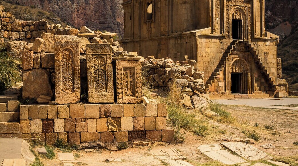 Beautiful old monestary in Armenia set amongst a set of mountains.