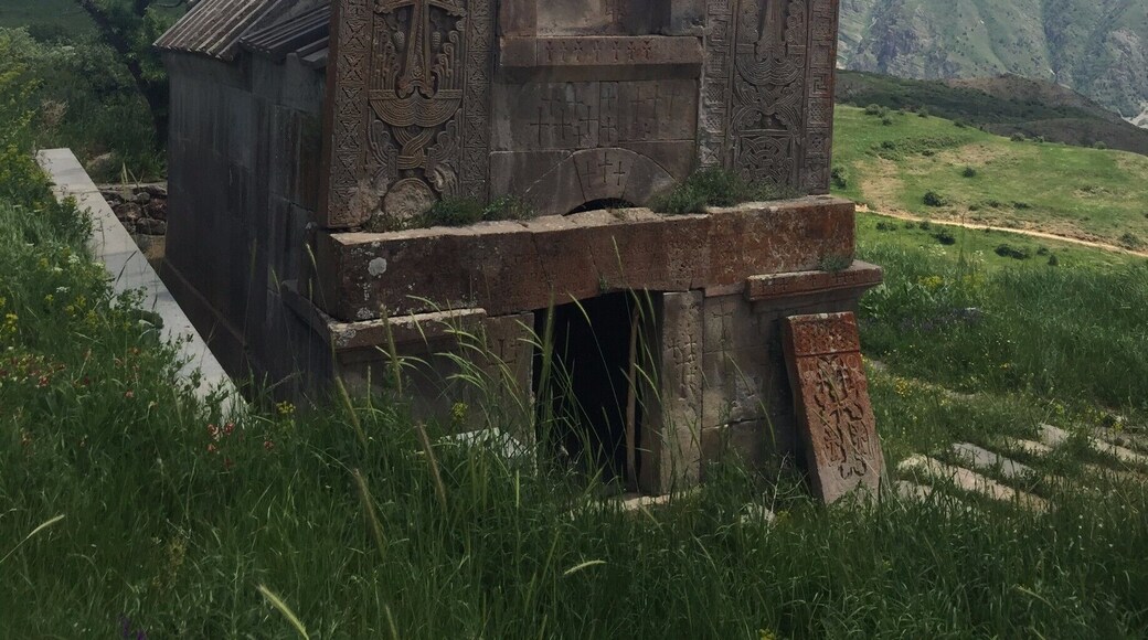 There was something of the old wild west of America about this little church. The flat facade, the mismatched stones propping up what seemed to be a false front. Inside a swarm of flies harkened decay, so I didn't proceed. Behind me along the trail was a fountain and a bench in the shade of tree where we ate lunch. Somebody had left a tea pot a spoon and an orange there. Even further behind me was the ruins of an ancient city complex whose walls were half hidden by the summer growth.
#tsakhats #monastery #armenia #mountains #armenian
https://www.visa-vis.com/armenia-1/