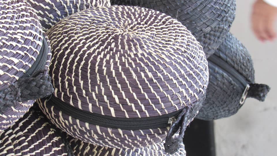 A close-up of a woven hat with a zigzag pattern.