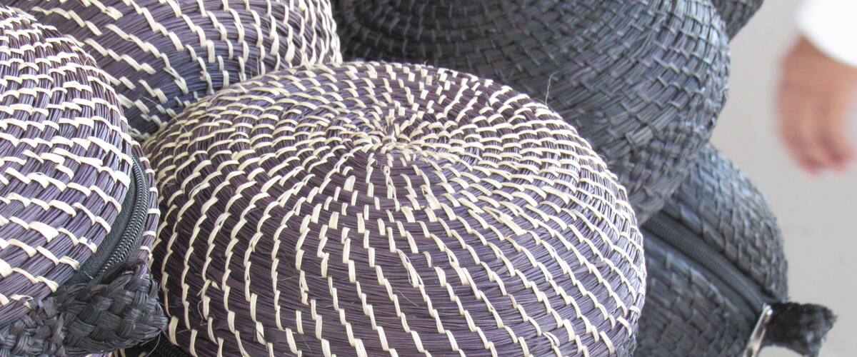 A close-up of a woven hat with a zigzag pattern.