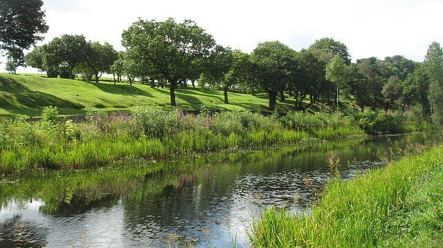 Forth and Clyde Canal passing Seabegs Wood View to the Antonine Wall on the southern side of the canal.