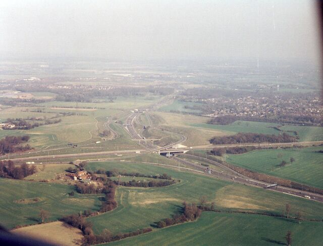 M25 Junction with M1 View along the M25, the M1 crosses the photo from right to left. The buildings in the foreground are Searches Farm and the town on the right is Bricket Wood. In the distance on the left is Chiswell Green.