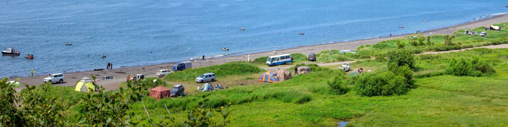Petropavlovsk-Kamchatsky beach in Zavoyko bay. Camping for fishermen and vacationers by the sea