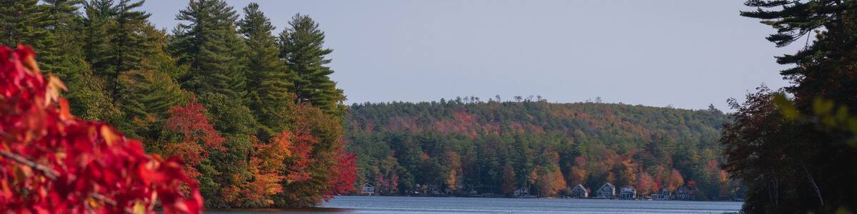 Foliage and boat on Wilson Lake - Acton, Maine.