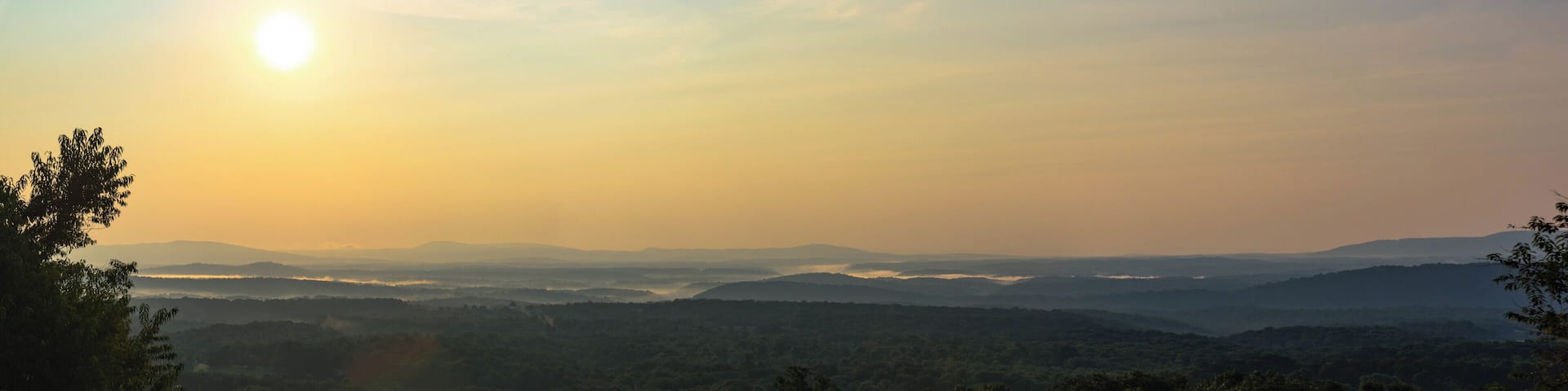 In the early morning hours of the day, at a rest stop, I was able to capture this moment with the fog as the sun rose.