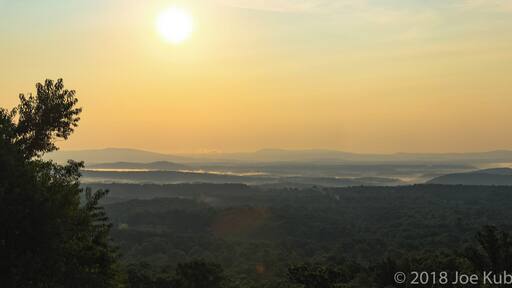 In the early morning hours of the day, at a rest stop, I was able to capture this moment with the fog as the sun rose.