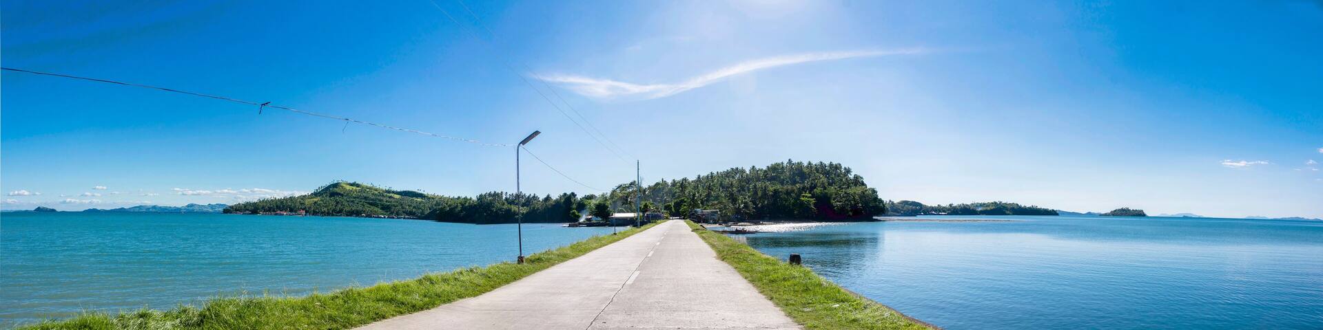 Panoramic shot of causeway in Buri Island near Catbalogan in Samar. Wide panorama of coastal road onroute to small village.