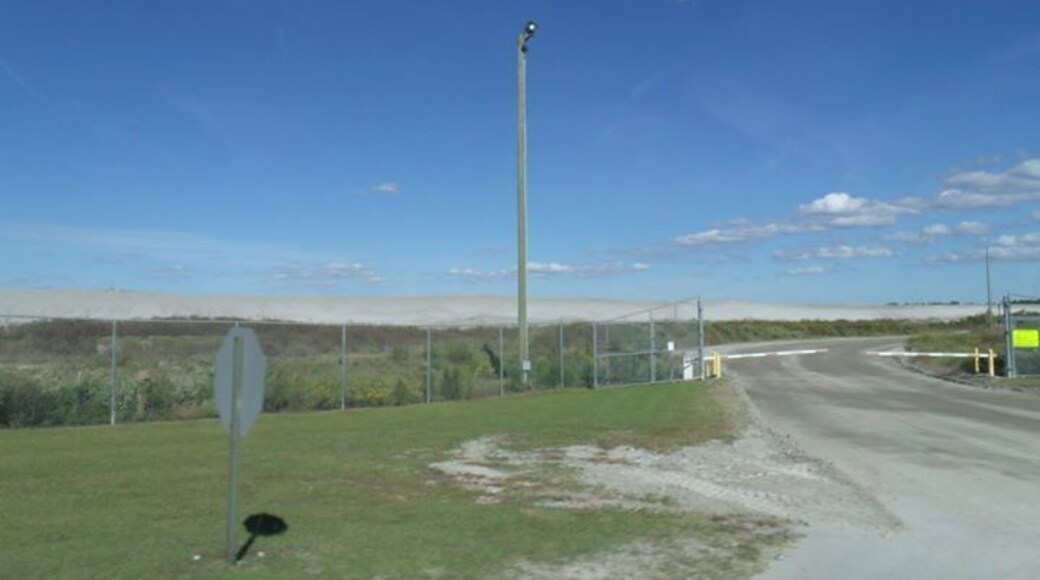 The mining area stretched for miles and miles. Desolation and absence of life. Not a beautiful sight but wanted you all to see how industry can strip the country side to produce pollutants. The gray hills are the reside of the mining and refining operations. The lakes you see in the picture are toxic.
