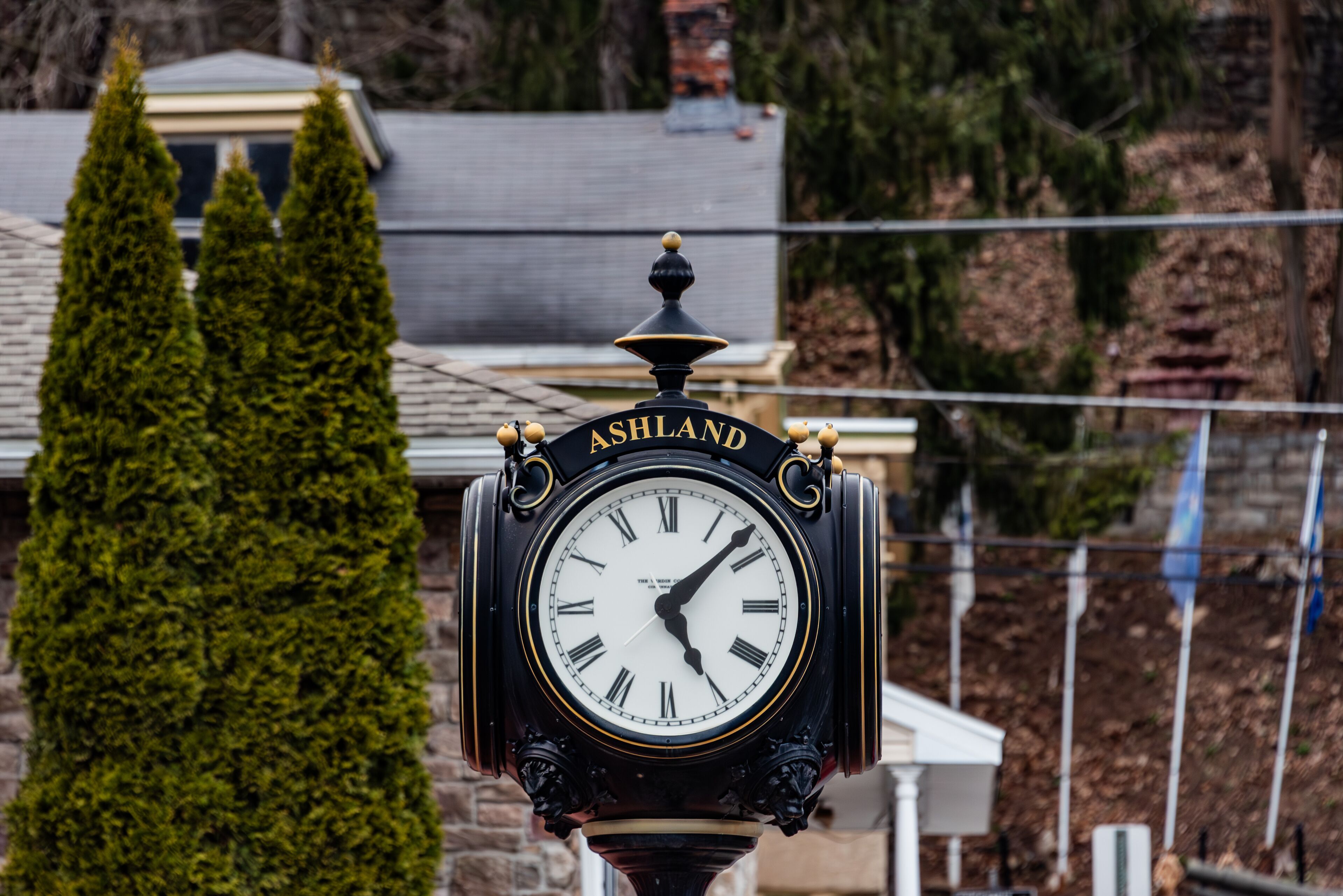 A black clock with gold accents and the word "ASHLAND" on it.