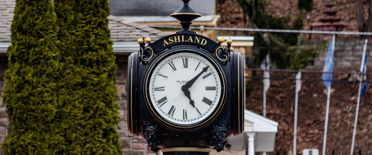 A black clock with gold accents and the word "ASHLAND" on it.