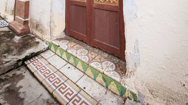 Old vintage wooden doors of a house dated 1920 in Kuala Pilah, Malaysia.