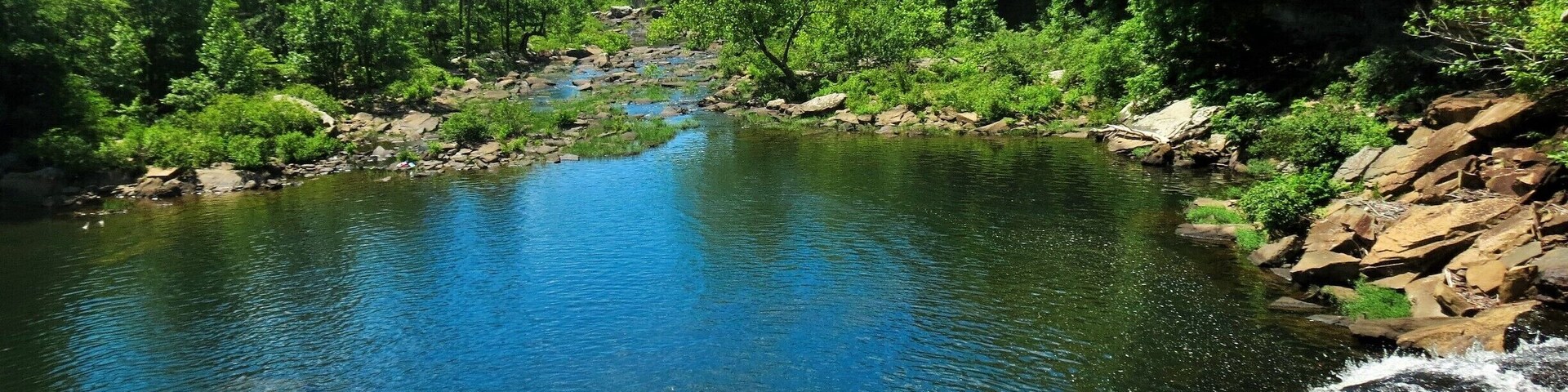 You can walk the paved path to see the falls from a distance, or you can stray off the path and see the falls from this vantage point. #hiking #waterlust
People used to be allowed to jump off the rocks around these falls, but after several deaths and emergency rescues that privilege was quickly revoked. Now there is a hefty fine for those who try.