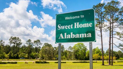 Welcome to Sweet Home Alabama Road Sign along Interstate 10 in Robertsdale, Alabama USA, near the State Border with Florida