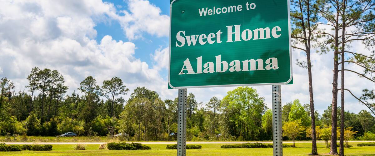 Welcome to Sweet Home Alabama Road Sign along Interstate 10 in Robertsdale, Alabama USA, near the State Border with Florida