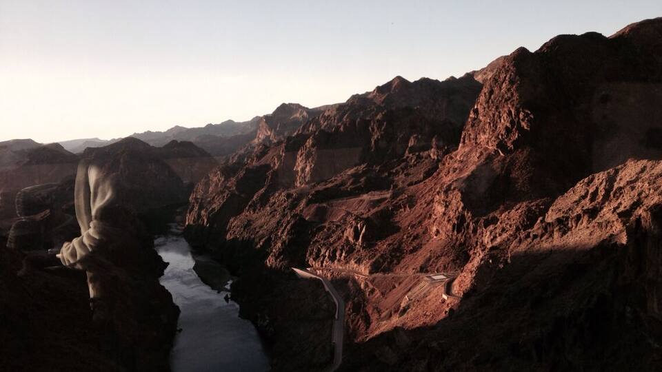 A rugged landscape with a winding river and rocky terrain.