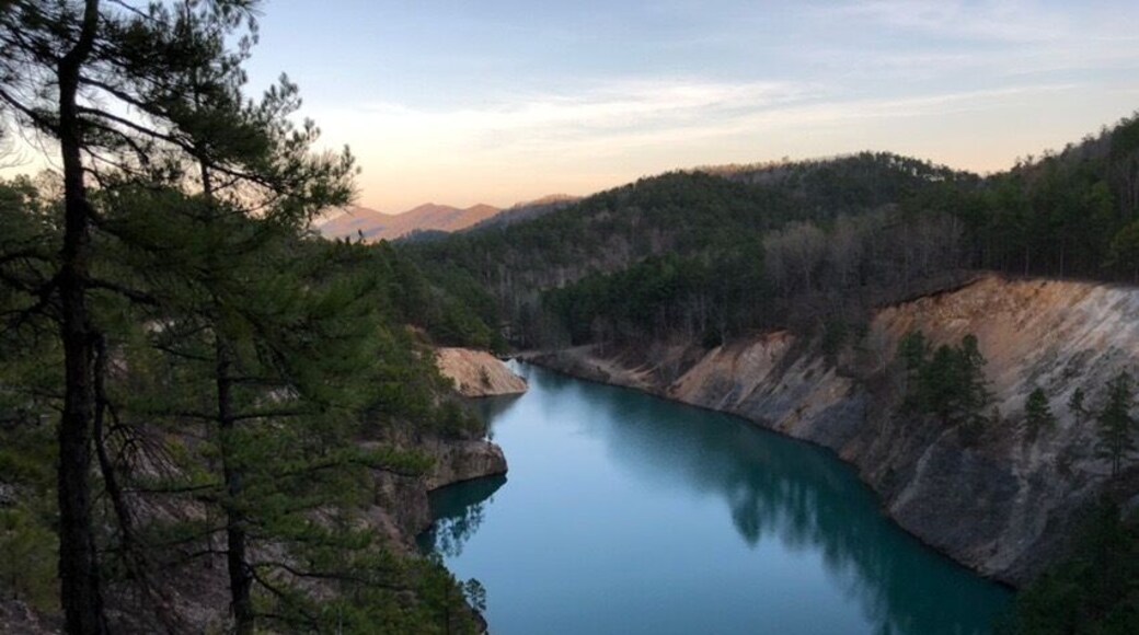 Might have to do a bit of hiking to get to this spot but it's worth it. Use to be a quarry and kids would throw all kinds of stuff down there