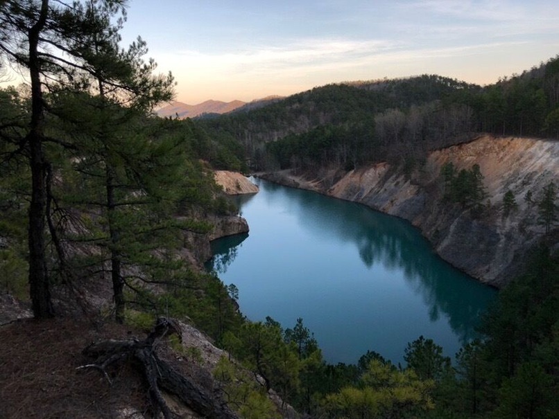 Might have to do a bit of hiking to get to this spot but it's worth it. Use to be a quarry and kids would throw all kinds of stuff down there