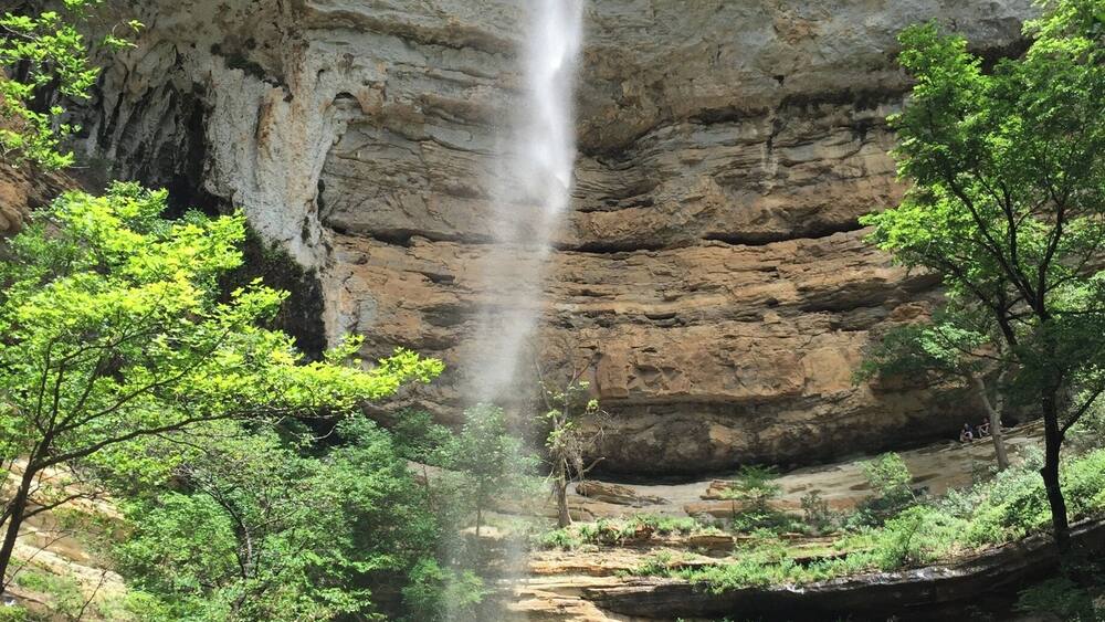 Hemmed-in Hollow is one of the beautiful waterfalls located in the Buffalo River Wilderness Area.
This towering waterfall is best accessed from the river. The trail is located between Steele Creek and Kyle's Landing, both popular camp areas and river access points along the Buffalo National River. I don't think the trail is marked, but it's not a secret and there are usually plenty of people who can guide you on where to stop. It's about a 1.5 mile trip each way with a little elevation gain...but not a difficult hike.
You can reach Hemmed-in Hollow over land, but that is a more strenuous hike.