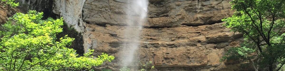 Hemmed-in Hollow is one of the beautiful waterfalls located in the Buffalo River Wilderness Area.
This towering waterfall is best accessed from the river. The trail is located between Steele Creek and Kyle's Landing, both popular camp areas and river access points along the Buffalo National River. I don't think the trail is marked, but it's not a secret and there are usually plenty of people who can guide you on where to stop. It's about a 1.5 mile trip each way with a little elevation gain...but not a difficult hike.
You can reach Hemmed-in Hollow over land, but that is a more strenuous hike.
