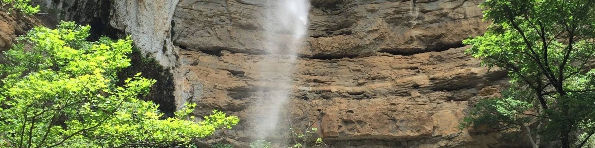 Hemmed-in Hollow is one of the beautiful waterfalls located in the Buffalo River Wilderness Area.
This towering waterfall is best accessed from the river. The trail is located between Steele Creek and Kyle's Landing, both popular camp areas and river access points along the Buffalo National River. I don't think the trail is marked, but it's not a secret and there are usually plenty of people who can guide you on where to stop. It's about a 1.5 mile trip each way with a little elevation gain...but not a difficult hike.
You can reach Hemmed-in Hollow over land, but that is a more strenuous hike.
