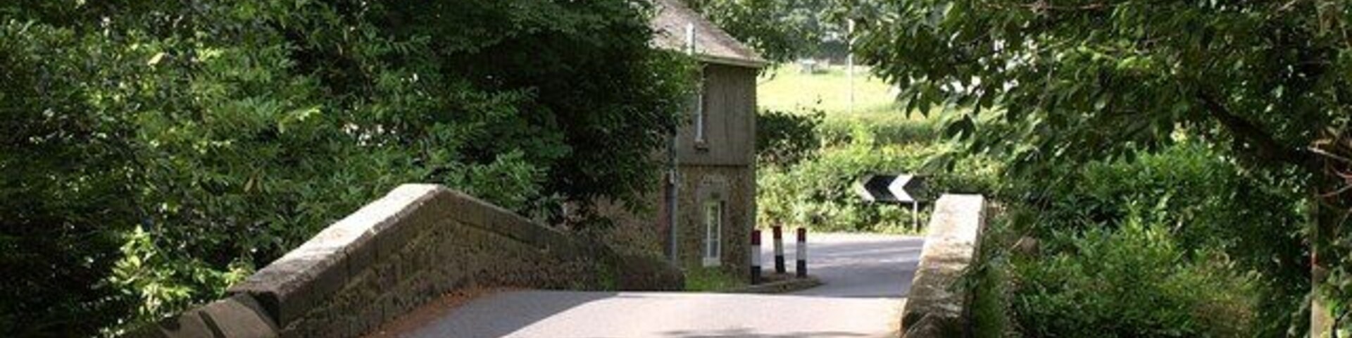 Lower Keaton Bridge. Another photo of 1411600. The Erme-Plym Trail, which has followed the road from 1411616, turns right on this side of the bridge up the left bank of the river.