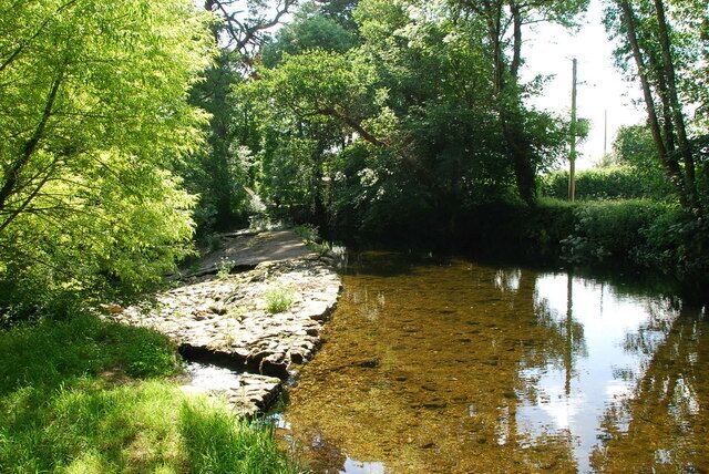 Weir on the Erme Just a short distance from Lower Keaton.The deeper water here is a good spot for watching Brown Trout and other aquatic life.