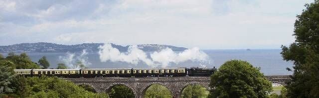 Steaming The Paignton & Dartmouth Steam Railway passing over the Hookhills Viaduct.