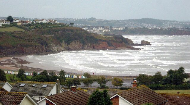 Rough seas, Broadsands bay. View from the Elberry estate, towards the North. Broadsands bay at mid-tide in the centre, Roundham head in the distant background and the high ground above Paignton on the skyline.
