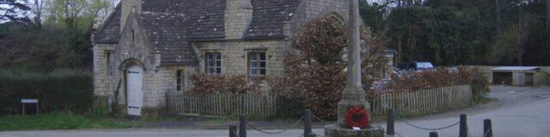War memorial, Stinchcombe With the 'Old School House' in the background.