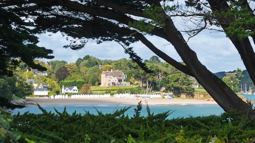 Idyllic beach huts and villa at Port-Manech, Brittany coast.