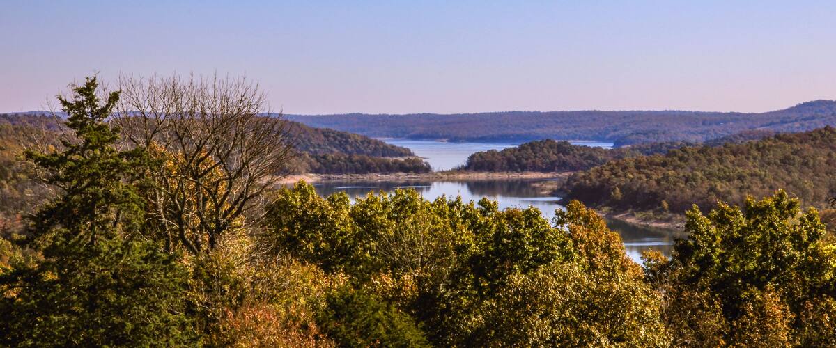 A lake surrounded by forested hills.