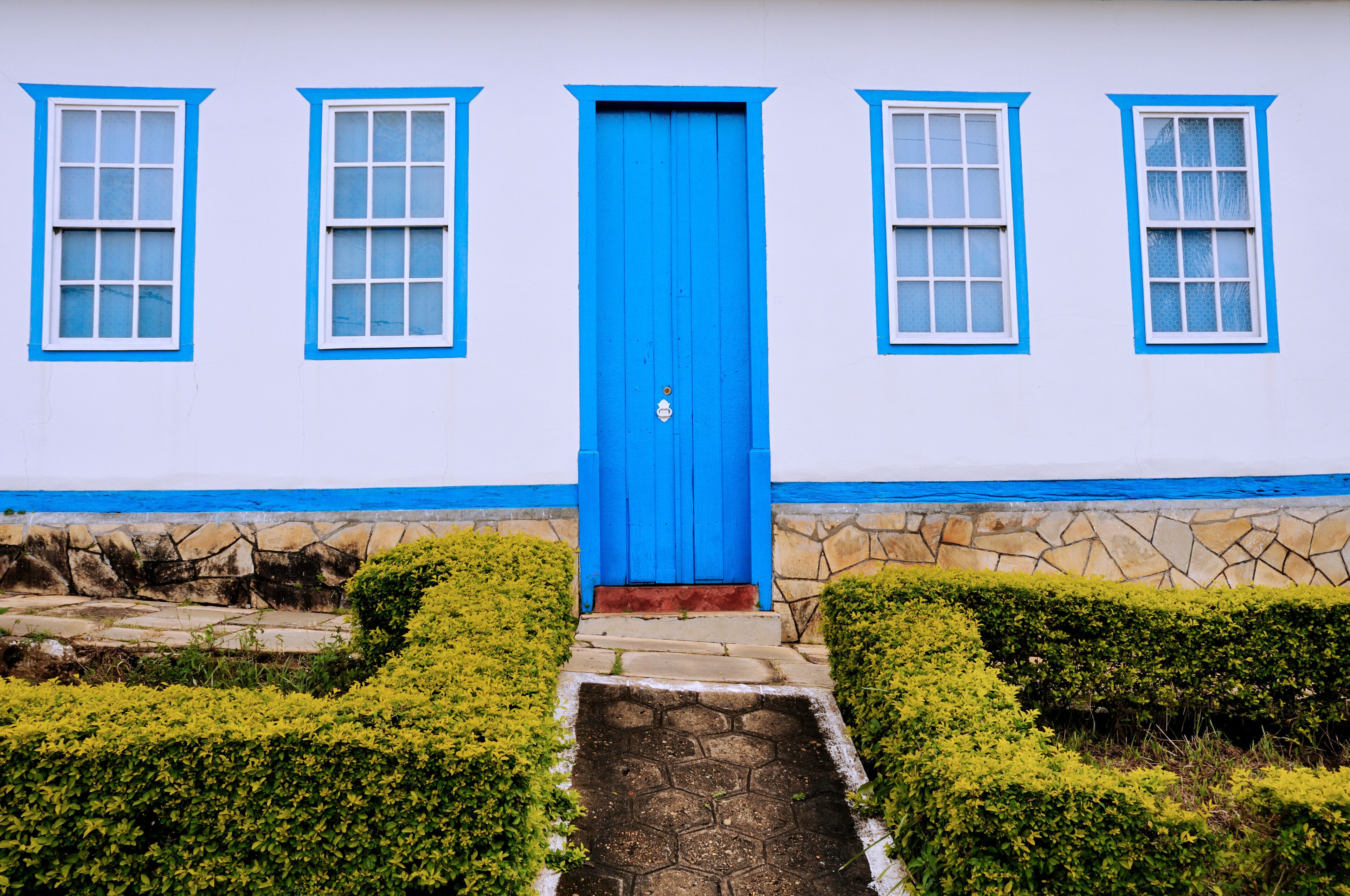 Colonial house door and windows in Corumbá de Goiás. This city was founded in 1730 by the Bandeirantes, explorers came from Sao Paulo State in search of gold. Goias, Brazil,  2019