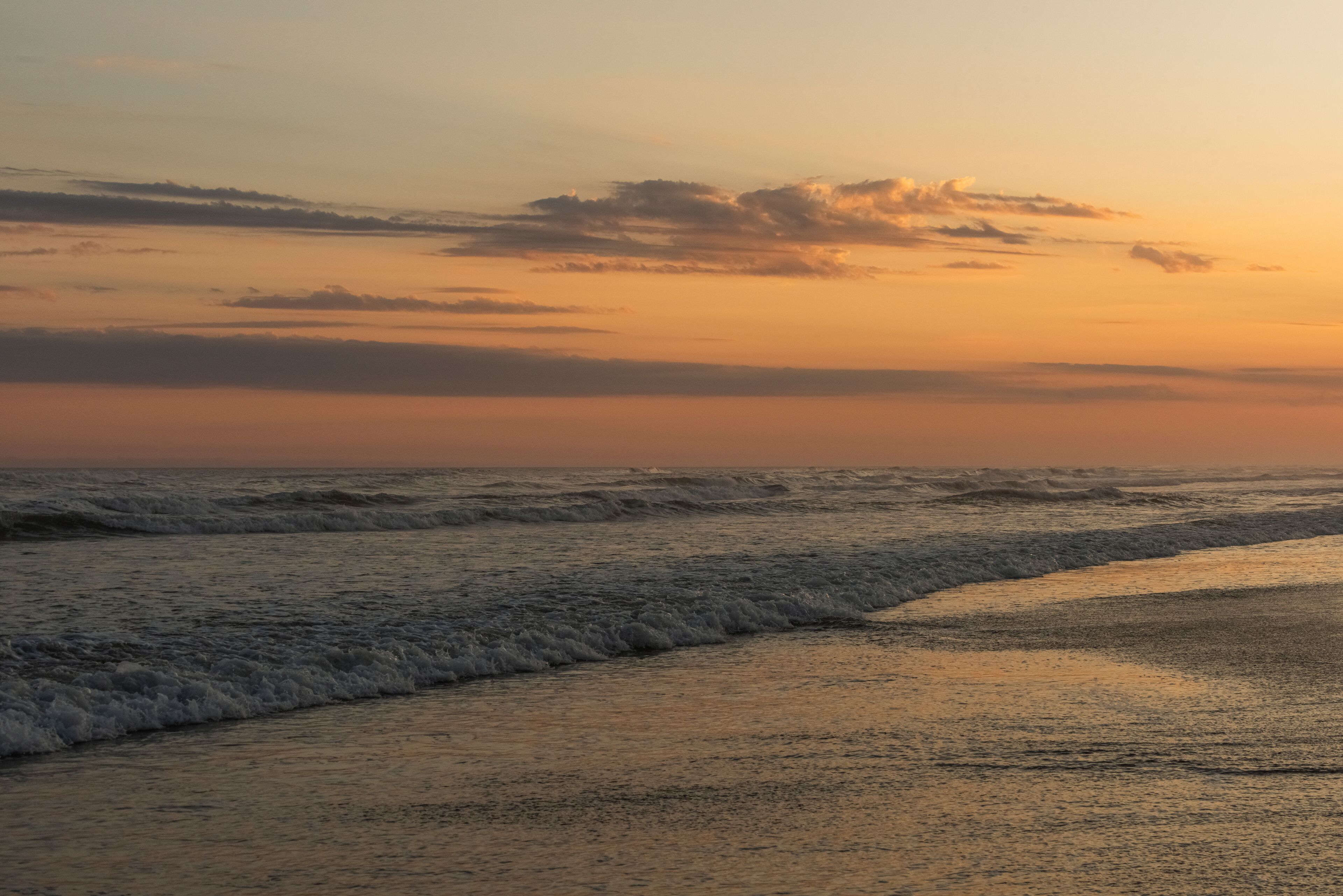 Orange and golden sunset sky calmness tranquil relaxing sunlight summer mood. , Jaguaruna Beach, Santa Catarina , Brazil