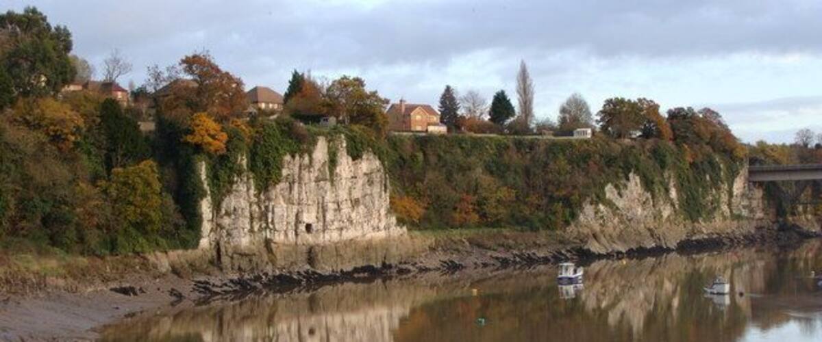 River cliff , reflections and houses with views An unusually tranquil moment for the River Wye, showing off its English bank to great effect.