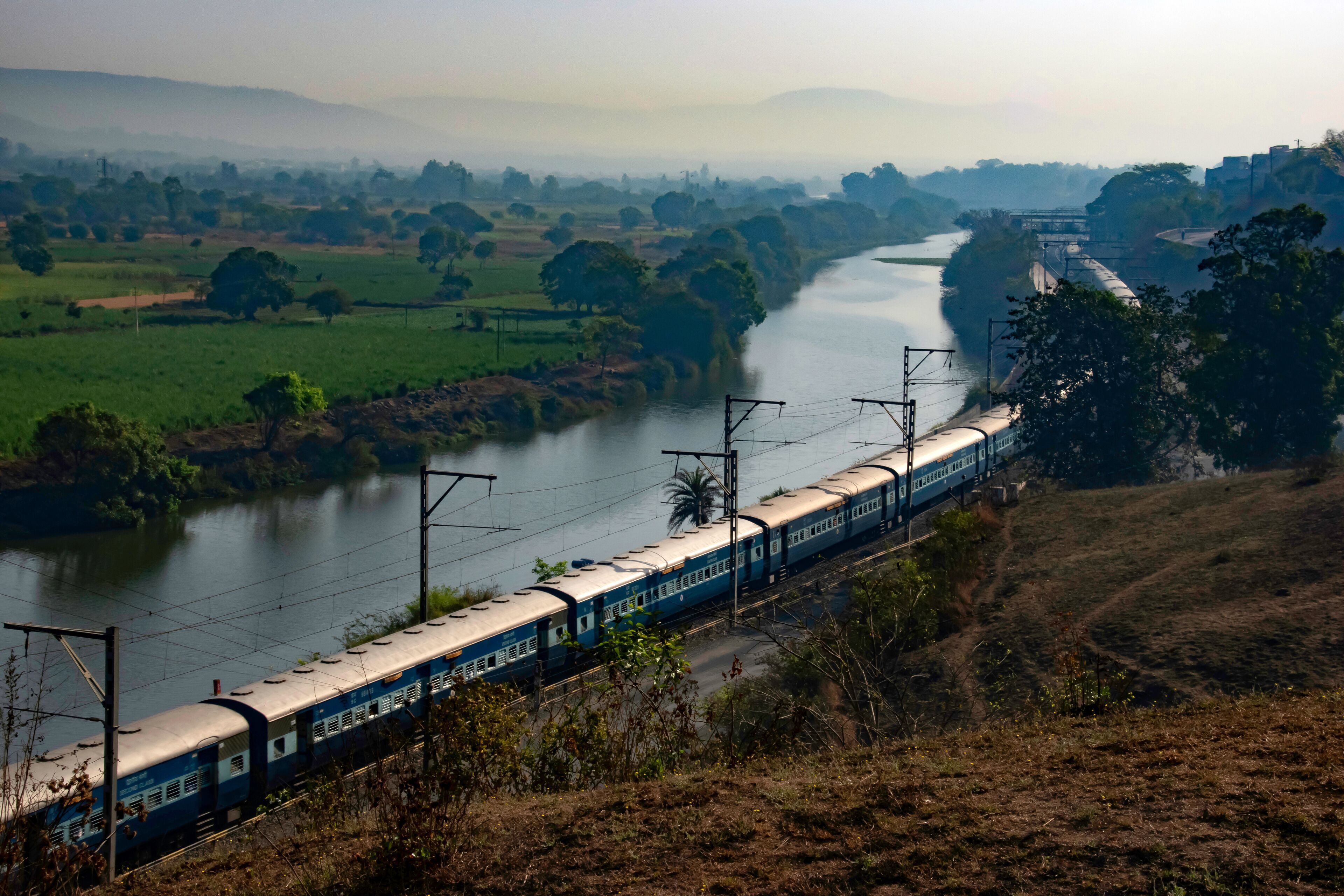 A passenger train amidst greenery at Kamshet near Pune India.