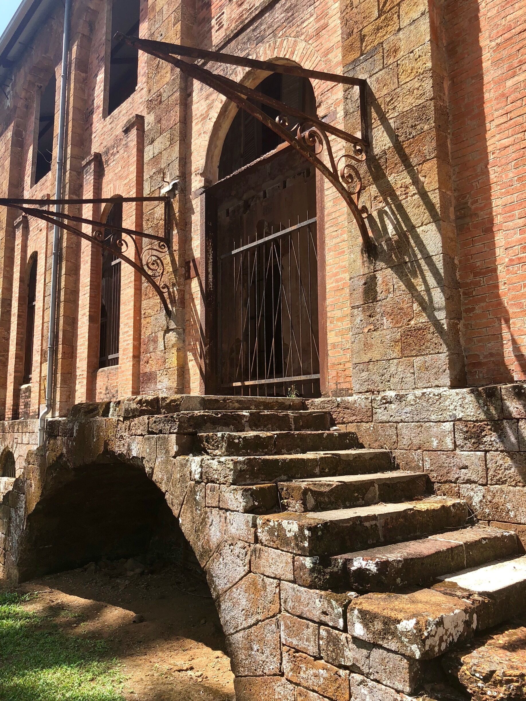 Dating to 1870, this was the prisons hospital. Here’s a bit more history: 

In the late 1840’s France had a problem with overpopulation in its prisons and made the decision to transport some of the prison population to the Iles du Salat (Salvation Islands). This particular set of islands is about 6 miles off of the coast of French Guiana and made up of Ile Royale, Ile Saint-Joseph and Ile du Diable. The French also installed prisons on the mainland of French Guiana as well as other islands located north of here. The prison was run on the Salvation Islands from 1852 until 1946. A law was passed by the French Government in 1853 that required convicts to stay in French Guiana following their release for a time equal to their sentence ... or, for sentences exceeding eight years, for the remainder of their life’s! So, incarceration here really was a life sentence with no ability to return to mainland France!  Interestingly, the islands are still part of France and the EU as is mainland French Guiana.