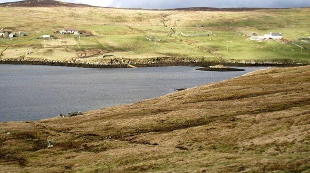 East Burra Firth, Aith Voe, Shetland. Photo taken looking north across East Burra Firth with the remains of a Broch just off the foreshore on the far side.