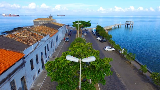 Aerial view of Monserrate historical buildings and pier with the sea in the background.