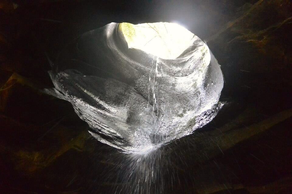 River has worn thru this rock over many years. Now the streams ends in a cave just beneath this opening.
