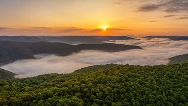 A foggy sunrise over the Arkansas Ozark Mountains - Calftail Cut on Hightway 43 near Centerpoint