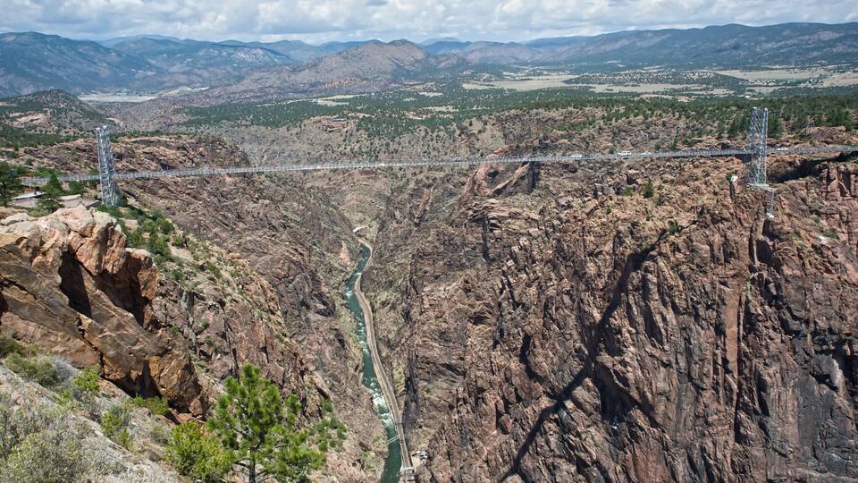 A canyon with a bridge spanning across it.