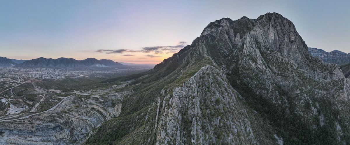 A rugged mountain range with a valley below.