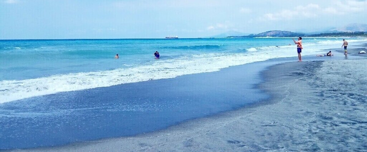 When waves are present, this place near Metro Manila is a good spot to surf. On a flat day, it's still a good spot to swim.  You can check Liwa in Zambales if you're up for the challenge.