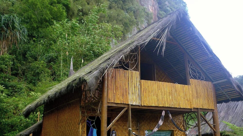 Harau Valley, Sumatra, Indonesia
We stayed at Abdi Homestay, one of only three other homestays in the area that we could see. It consists of five bungalows (one attached to kitchen) that in one direction faces a rice field and the other is against a sheer cliff with a waterfall. It’s the perfect setting to sit back in one of their hammocks and relax and read a book.
The bungalows are extremely spacious with a large bed downstairs, a clean washroom with Western toilet and mandi shower and a loft upstairs with another bed and a small patio. There is always a flask of boiling water on your table for all day tea and coffee.
At 120,000 rupiah per night (that's $12 Canadian!) it was a sweet escape.
#indonesia #sumatra #bungalow
http://kileetravels.com/harau-valley