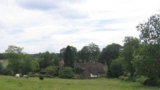 Epwell Mill. Seen across the fields from the bend in the lane to Epwell.